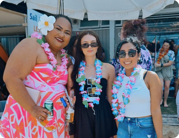 Three Prvidr employees at Hawaiian themed Christmas party