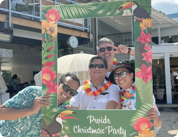 Prvidr employees at Hawaiian themed Christmas party